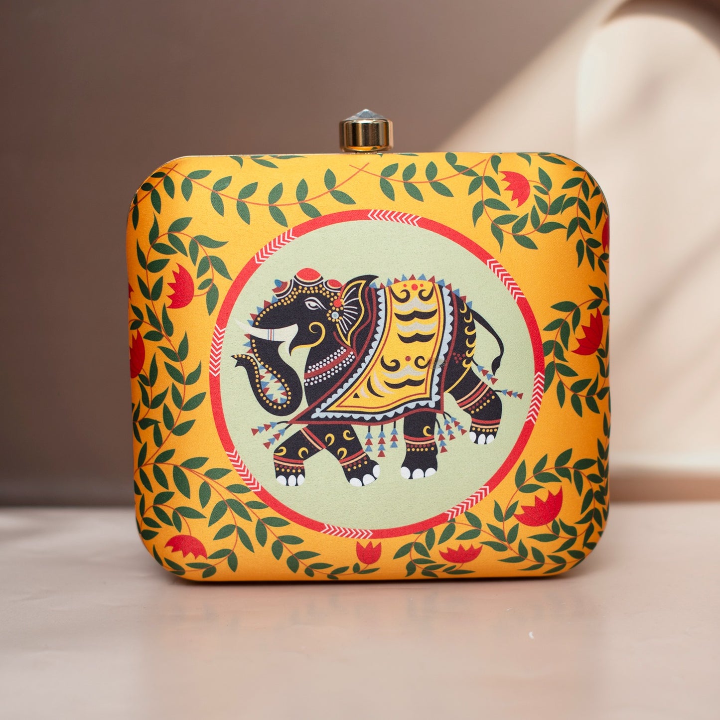 Yellow elephant printed clutch