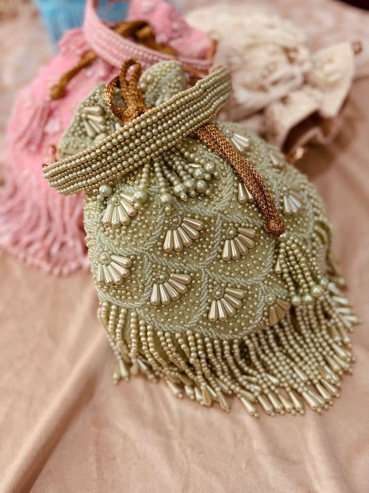 Bead work potli with pearl handle
