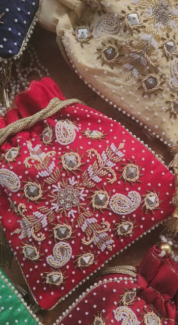 Raw silk fabric potli with zardosi and pearl work