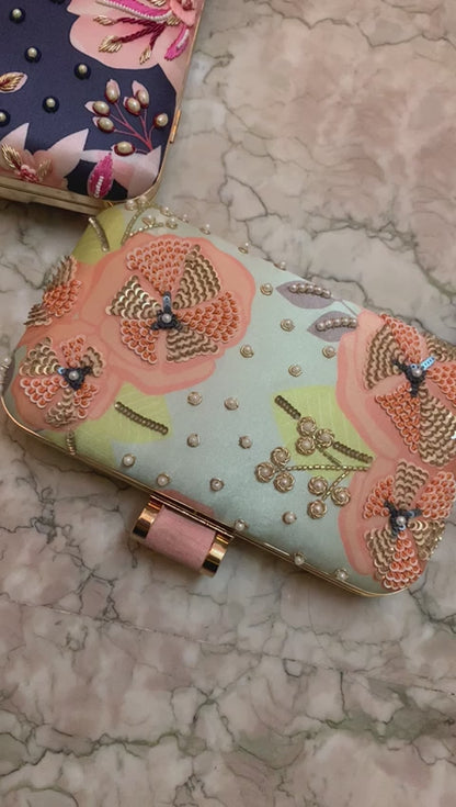 Blue printed clutch with pink embroidery work