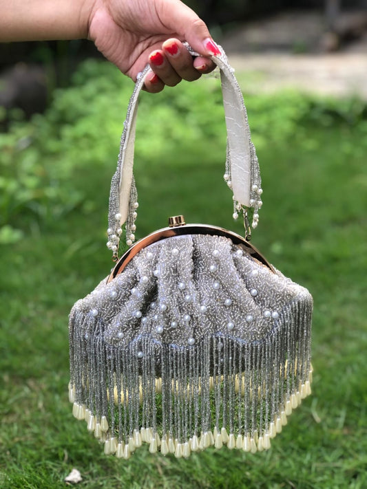 Grey half frame white pearl potli bag with tassels