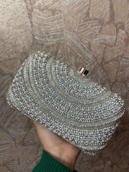 Designer silver clutch with piping & pearl work