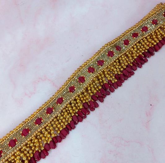 Golden waistbelt with dark pink bead work