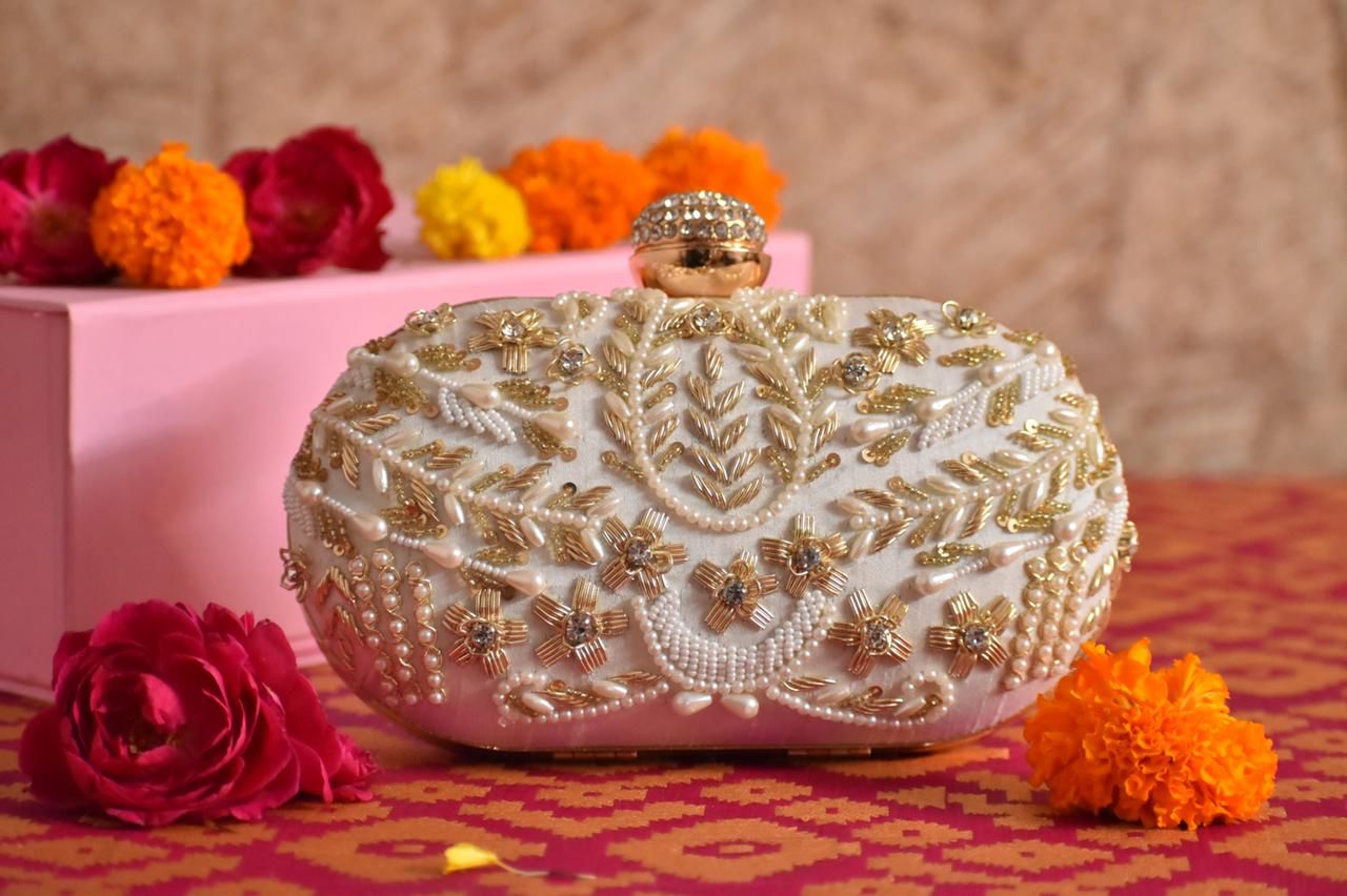 White Oval embroidered clutch with designer knob and bead work