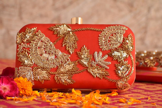 Orange Clutch with golden embroidery work