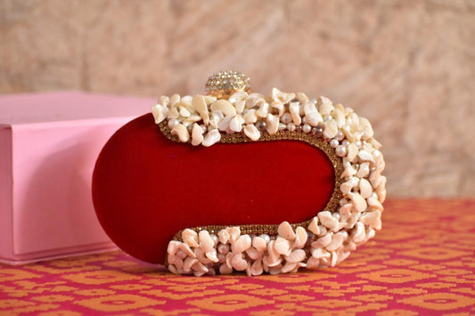 Oval shape clutch with shell work and designer knob - Red