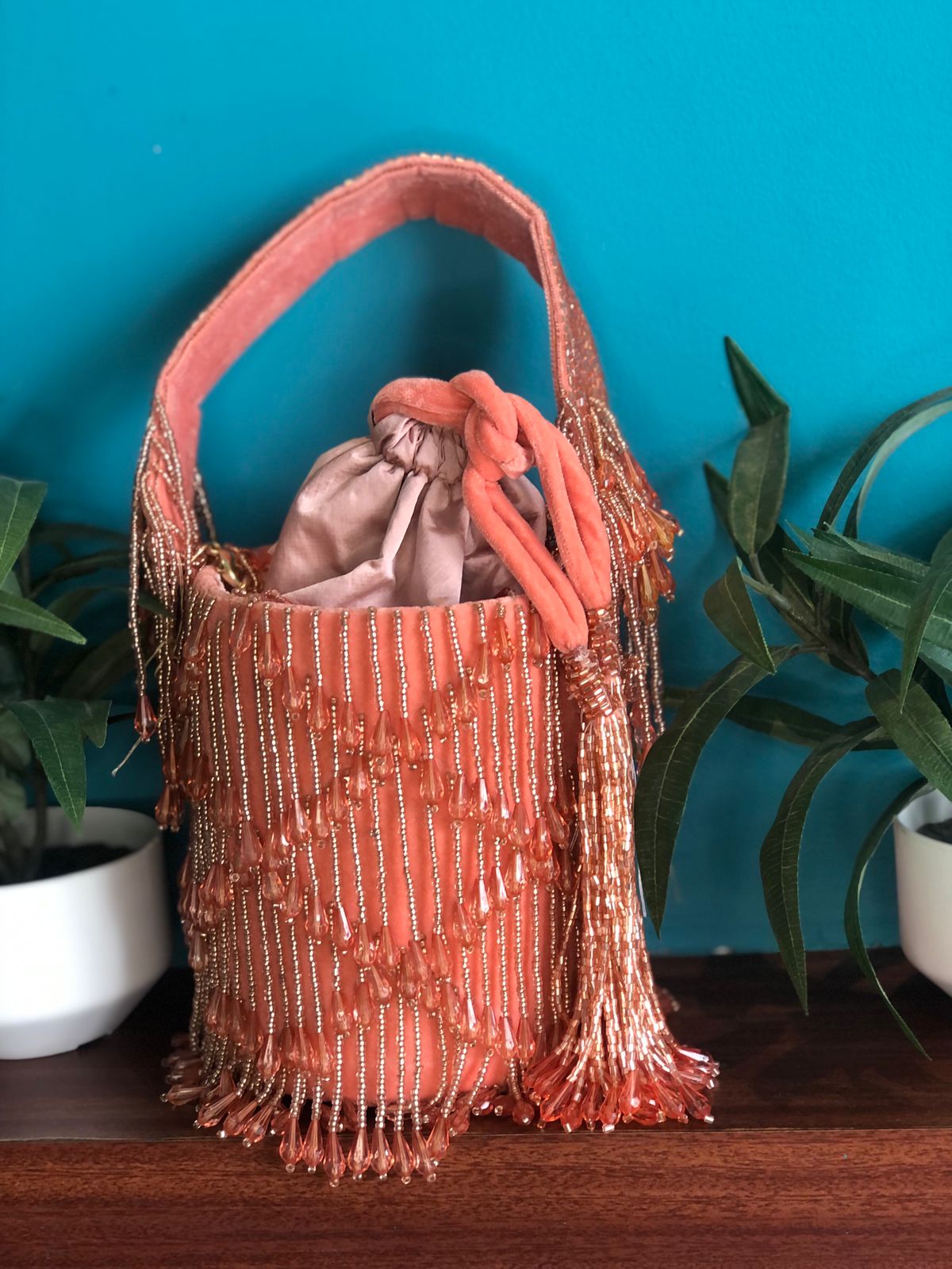 Celebrity style PEACH drawstring potli bucket bag with karadana pearl drops - EXCLUSIVE COLLECTION