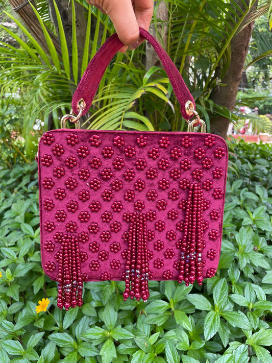 Suede suitcase handbag with hanging pearls