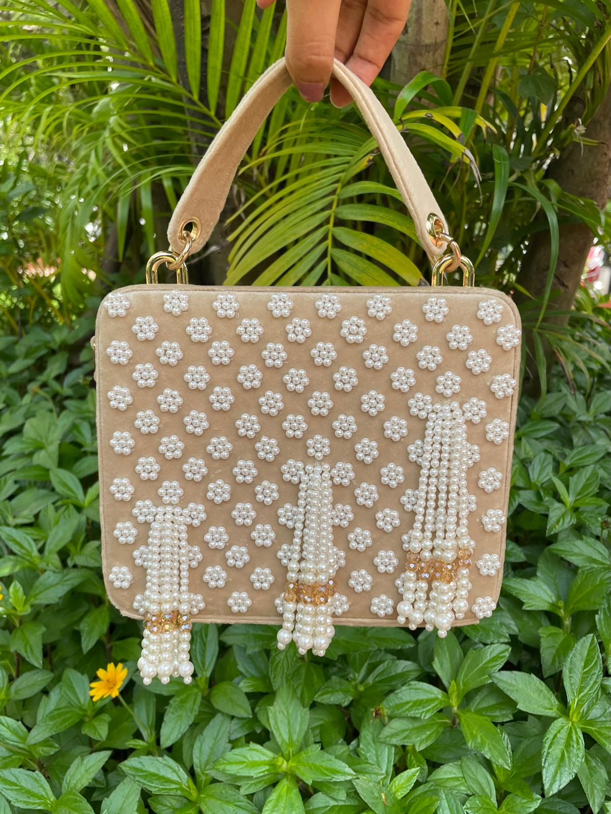 Suede suitcase handbag with hanging pearls