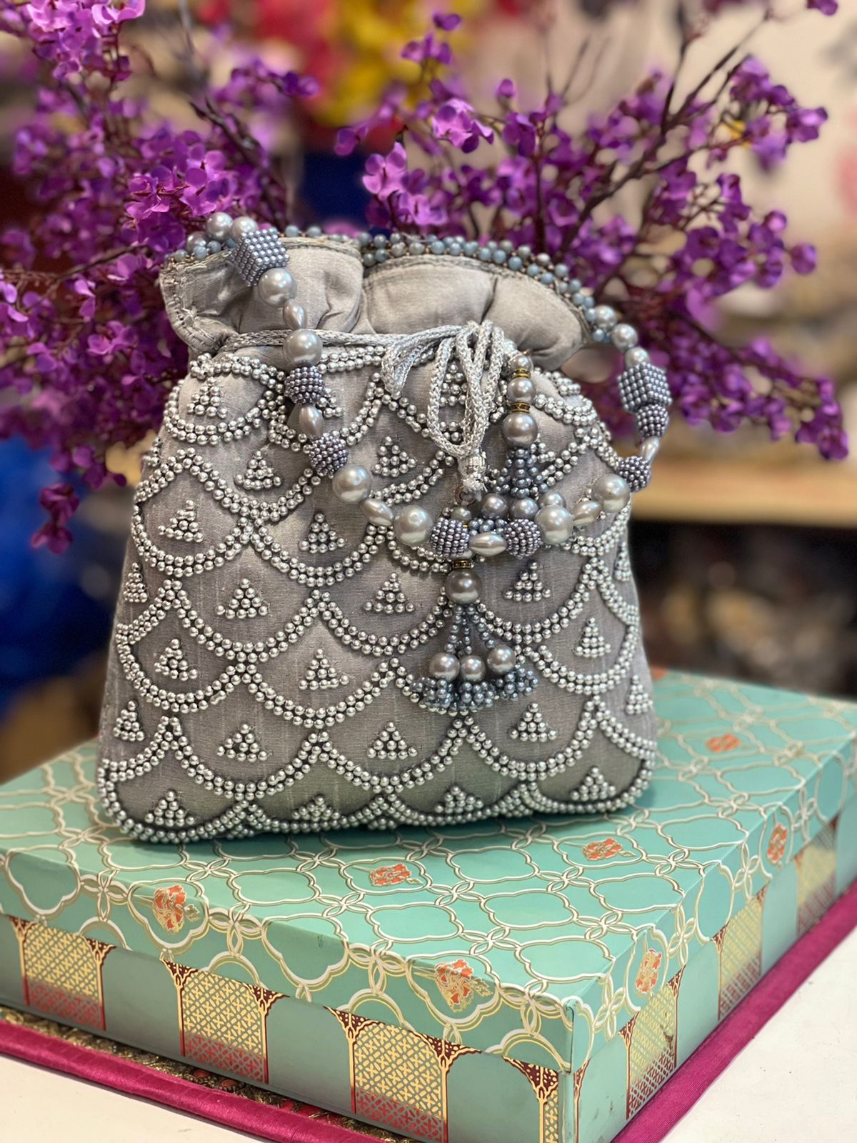 Pearl work potli bag with latkan