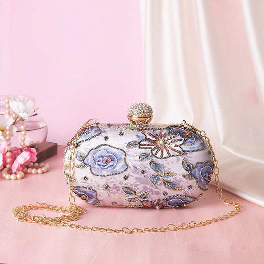 Lavender oval shape printed clutch with embroidery work