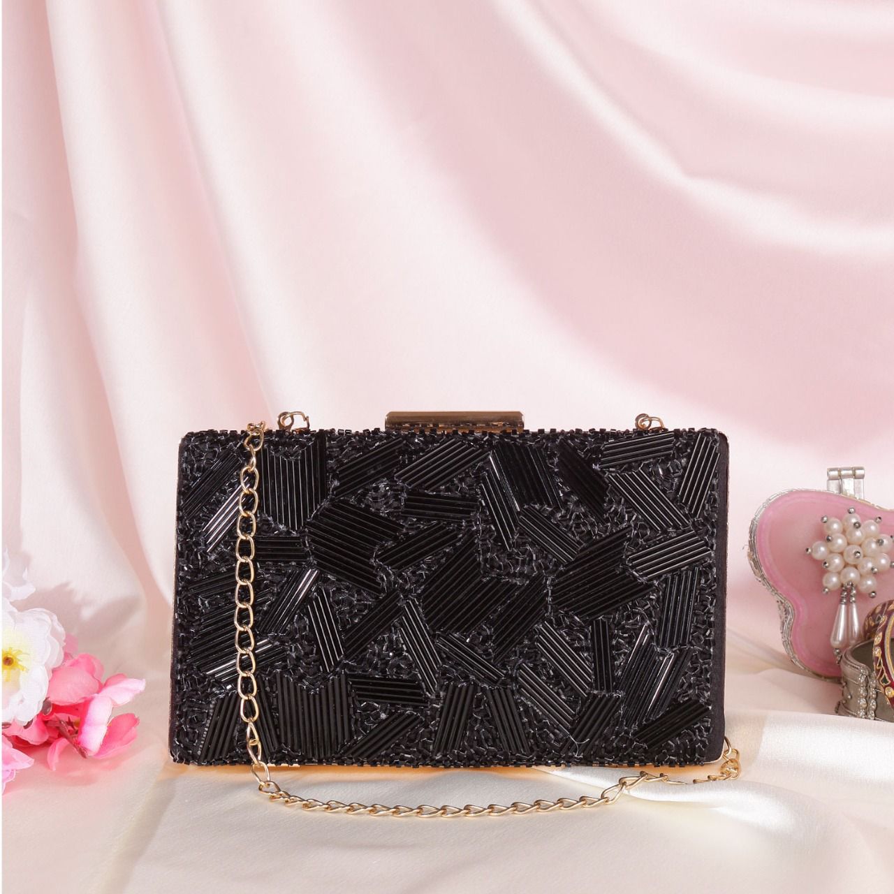 Black clutch with piping and bead work