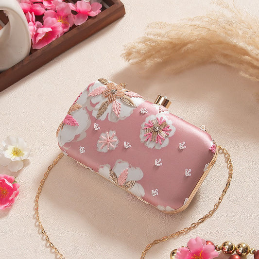 Pink printed clutch with floral embroidery work