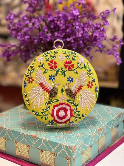 Round embroidered clutch with bead work