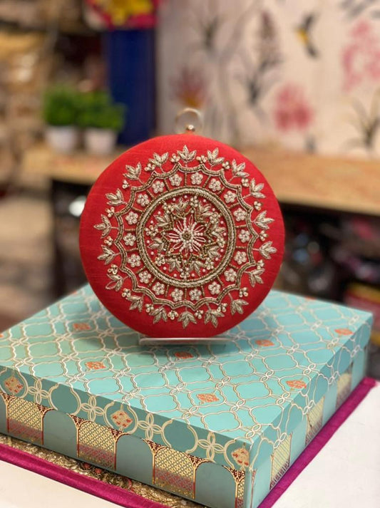 Round embroidered clutch with golden work