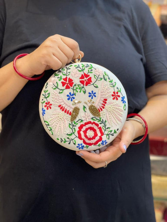 Round embroidered clutch with bead work