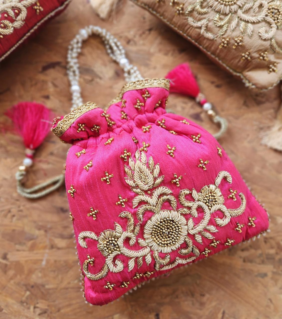 Zardosi work potli with pearl handle