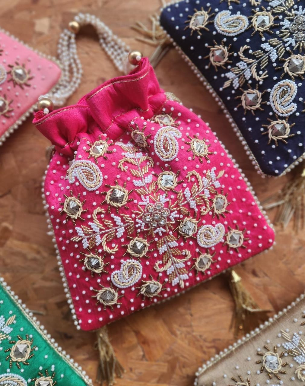 Raw silk fabric potli with zardosi and pearl work