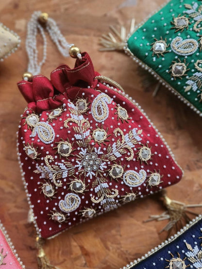 Raw silk fabric potli with zardosi and pearl work