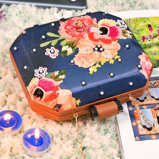 Blue printed clutch with peach sequins & embroidered flower