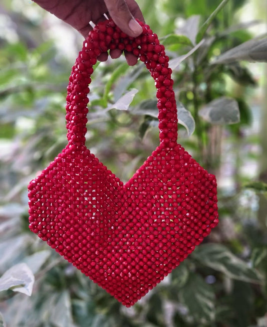 Mesmerizing maroon pearl work heart bag