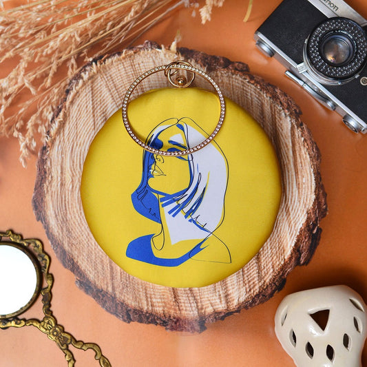 Yellow face print round clutch with bangle handle