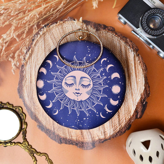 Navy blue MOONS & STARS print round clutch with bangle handle