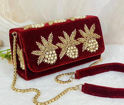 Box flap bag with golden embroidery and bead work