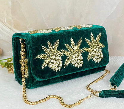 Box flap bag with golden embroidery and bead work