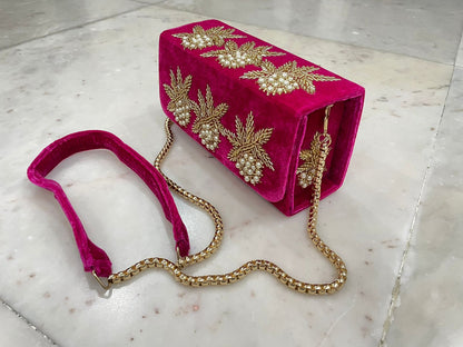 Box flap bag with golden embroidery and bead work