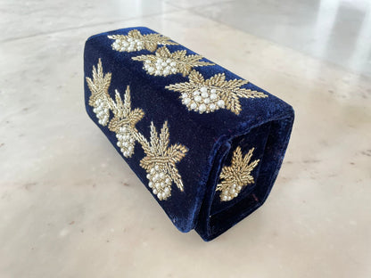 Box flap bag with golden embroidery and bead work