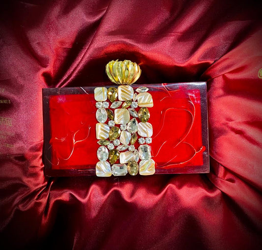 Red resin clutch with flower knob and stone work