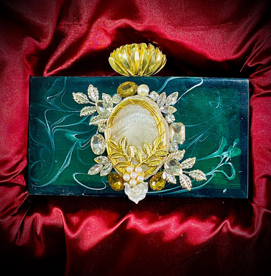 Emerald green resin clutch with flower knob and stone work