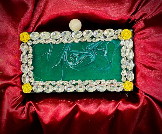 Emerald green resin clutch with round knob and stone work