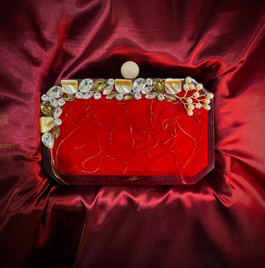 Red resin clutch with round knob and glass stone work