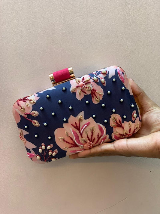 Blue printed clutch with pink embroidery work