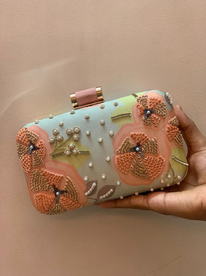 Mint green printed clutch with peach embroidery work