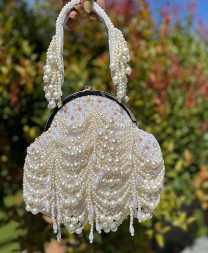 Half frame white potli bag with pearl work