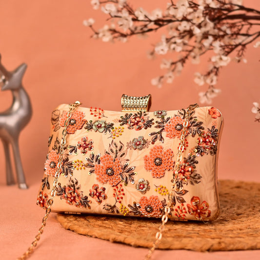 Peach printed clutch with sequins & floral embroidery